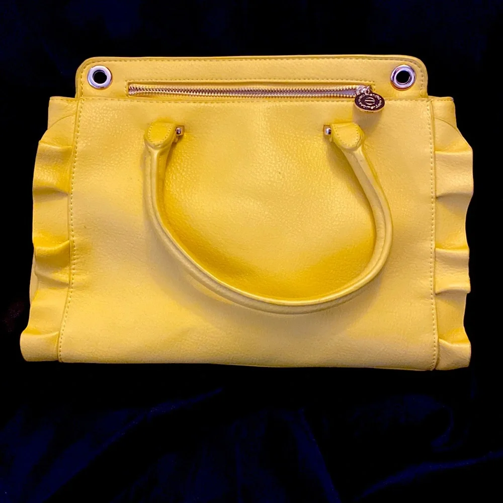 YELLOW EVA MENDES NEW YORK & COMPANY HANDBAG. It has 2 dividers with zippers.